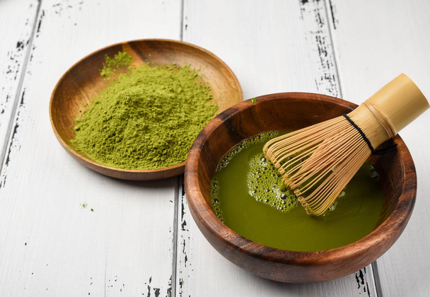 Japanese green tea matcha in a wooden bowl. - Fotografie, Obrázek