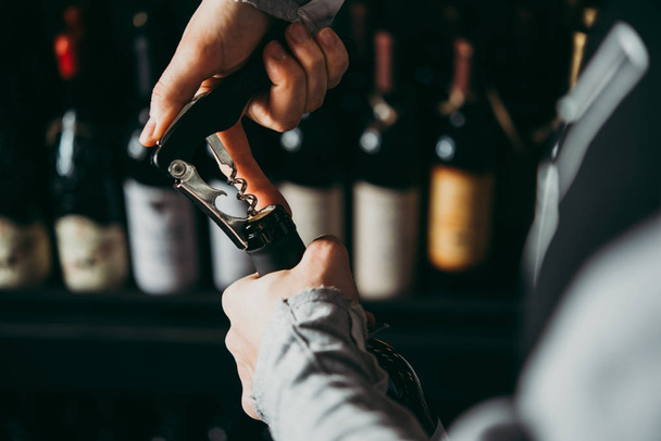Opening a wine bottle. - Photo, image