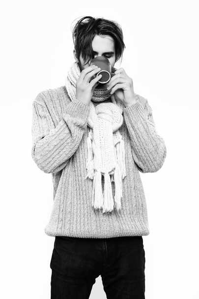 handsome bearded man with cup in sweater and scarf - Фото, изображение