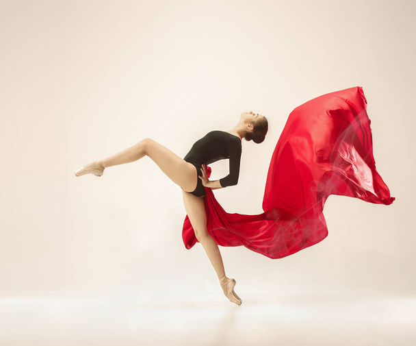 Modern ballet dancer dancing in full body on white studio background. - Zdjęcie, obraz