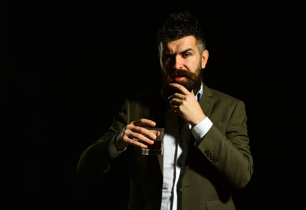 Businessman with beard and beverage on black background - Zdjęcie, obraz