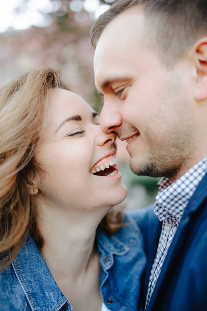 Faces of amorous young couple laughing with closed eyes - Photo, Image