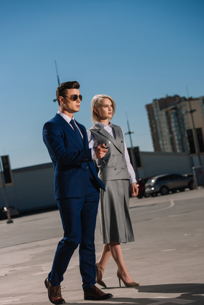 young attractive business people walking on parking - Photo, Image