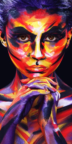 Portrait of the bright beautiful girl with painting art colorful make-up on face and bodyart. Creative vertical ads banner or flyer with copy space. - Foto, afbeelding