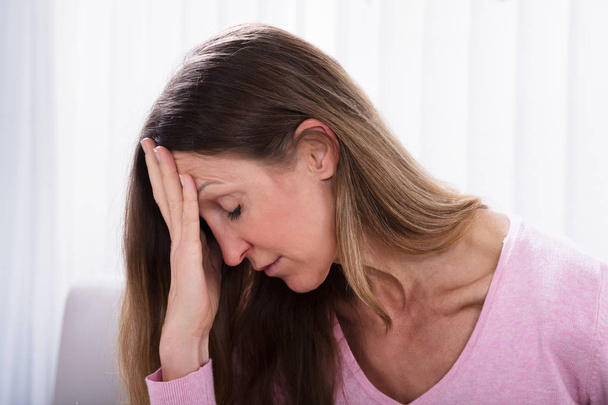 Close-up Of Depressed Mature Woman At Home - Фото, изображение