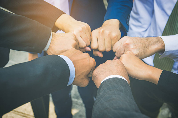 Businesspeople hands in fists in circle, business and teamwork concept - Photo, Image