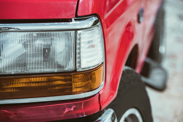 close up of of headlight of red jeep - Φωτογραφία, εικόνα