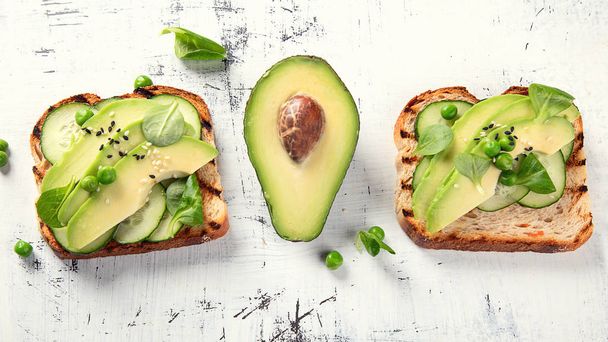 Avocado toasts, healthy vegetarian and diet concept - Фото, изображение