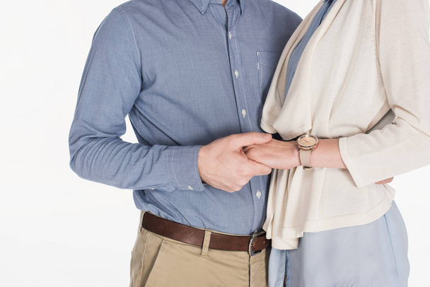 cropped shot of married couple holding hands together isolated on white - Photo, image