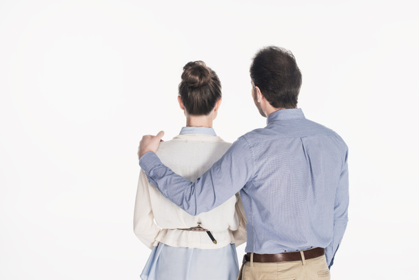 back view of man hugging wife isolated on white - Foto, afbeelding