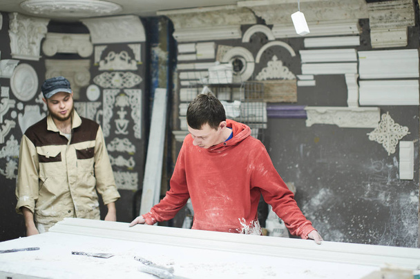 Team of professional sculptors working on gypsum decorations - Fotoğraf, Görsel