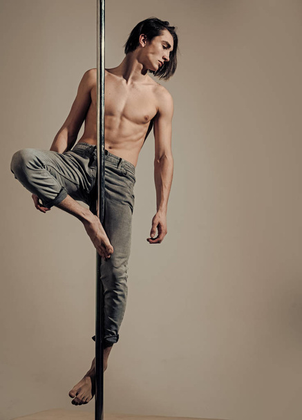 Face boy for magazine cover. Man face portrait in your advertisnent. Athlete, sportsman performing pole dancing moves, work out, - Valokuva, kuva