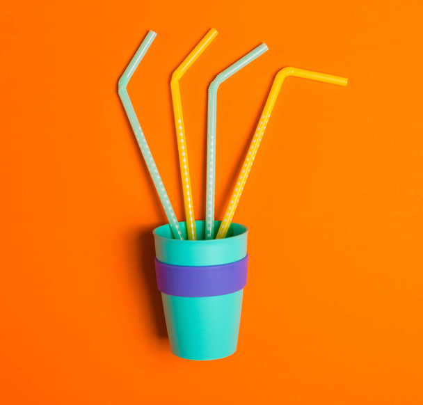 Bright summer background with a drinking straws - Foto, imagen