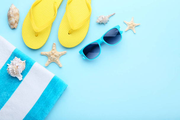 Summer accessories with seashells on blue background - Valokuva, kuva