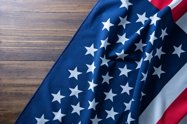 USA flag on wooden table for background. - Foto, Imagem