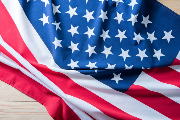 USA flag on wooden table for background. - Φωτογραφία, εικόνα