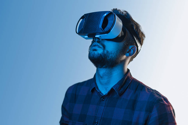 Man in VR headset looking up - Photo, Image