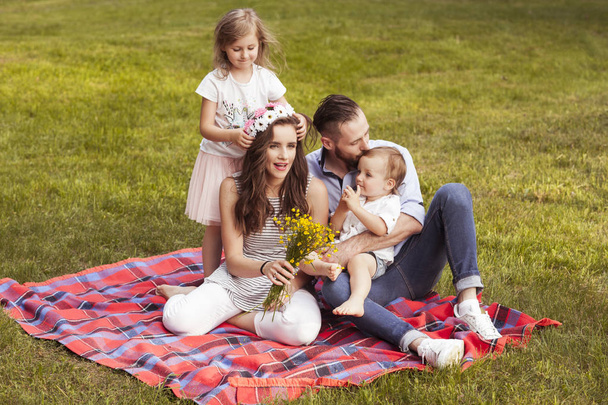 Young family is spending time outside in the park. - Photo, Image