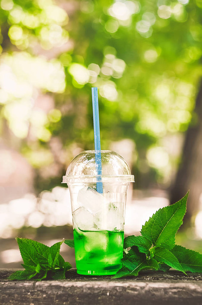 cocktail with ice cubes and straws. mint leaves . summer weather - Valokuva, kuva