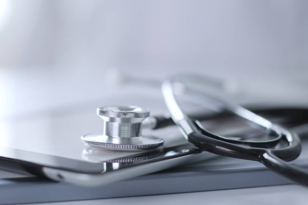 Medical equipment: blue stethoscope and tablet on white background. Medical equipment - Foto, Imagen