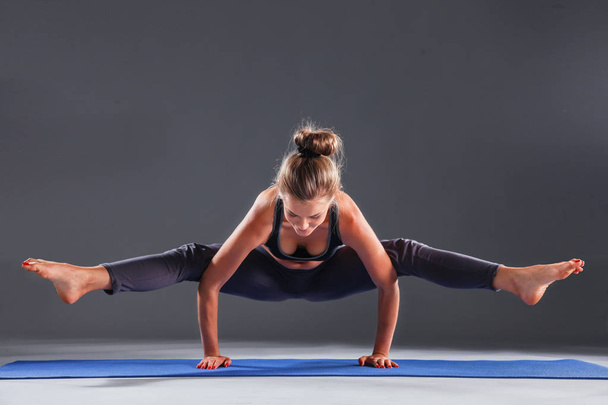 Portrait of sport girl doing yoga stretching exercise . yoga - Photo, Image