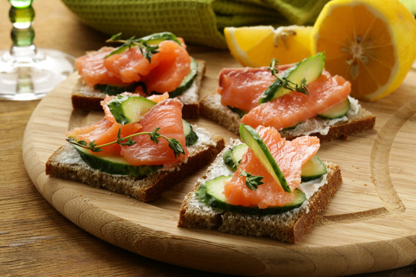 canape sandwiches with salmon and cucumber - Photo, Image