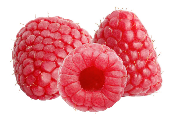 Isolated berries. Three raspberry fruits with leaves isolated on white background with clipping path as package design element and advertising. - Foto, imagen