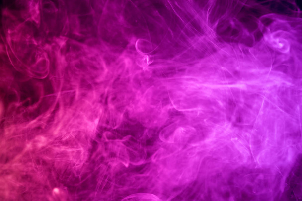 Thick pink smoke on a black isolated background. Background from the smoke of vap - Fotoğraf, Görsel