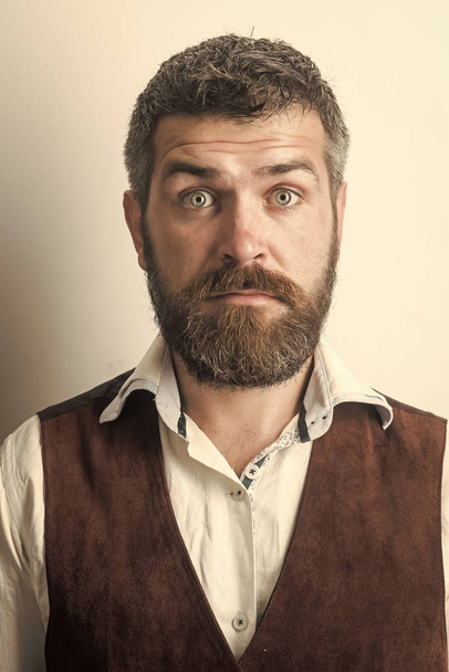 Man face handsome. Man with long beard and mustache on surprised face. - 写真・画像