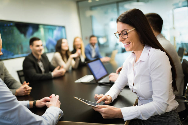 Picture of attractive smiling businesswoman in conference room - Photo, Image