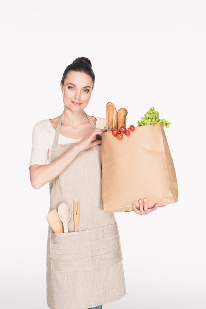 portrait of woman with paper package with grocery isolated on white - Foto, afbeelding