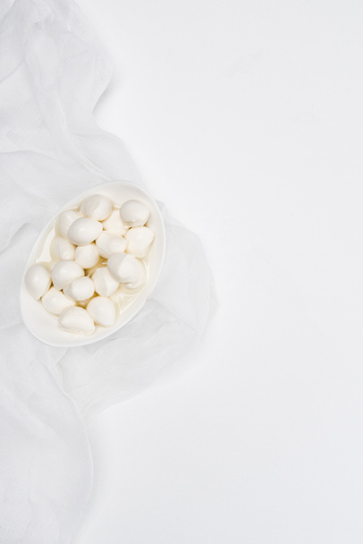 top view of delicious mozzarella cheese curds on white surface - 写真・画像