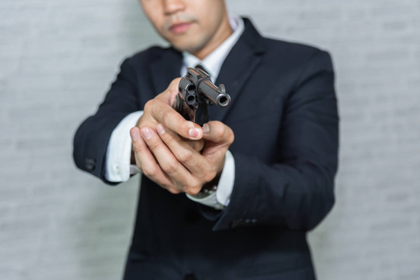 businessman with black suit and gun - Foto, Imagem