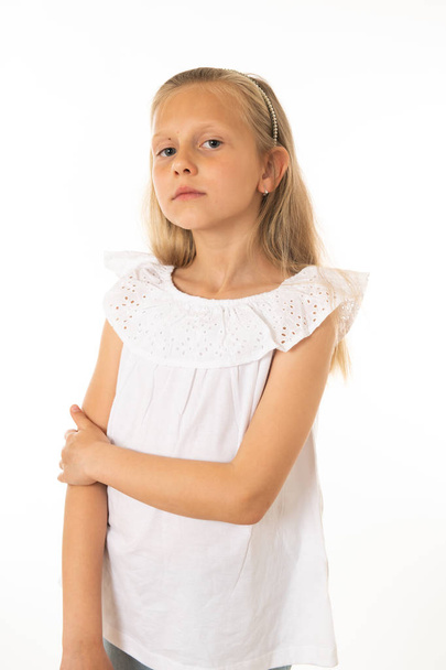 Close up portrait. Cute curious, confident, successful, proud little girl looking at the camera arms crossed. Human emotions, facial expressions, body languages and feelings. White background - Photo, Image