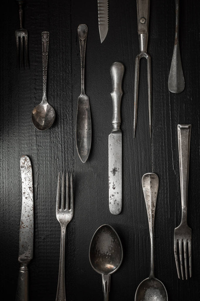 Old Rustic Cutlery on Dark Wooden Background. Kitchen and Food Concept. - Zdjęcie, obraz