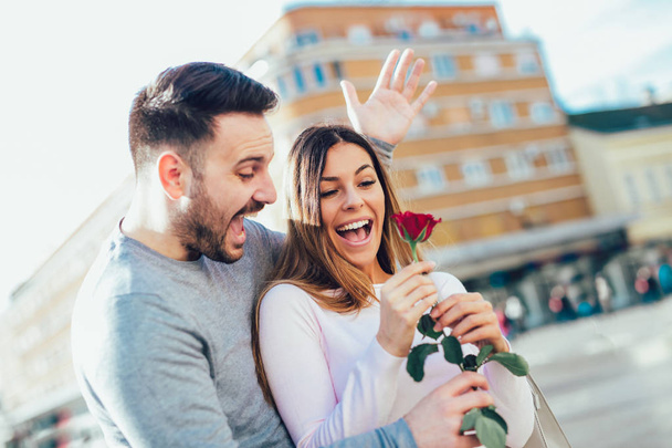 Boyfriend surprised his girlfriend with rose for Valentine's day. - Fotografie, Obrázek