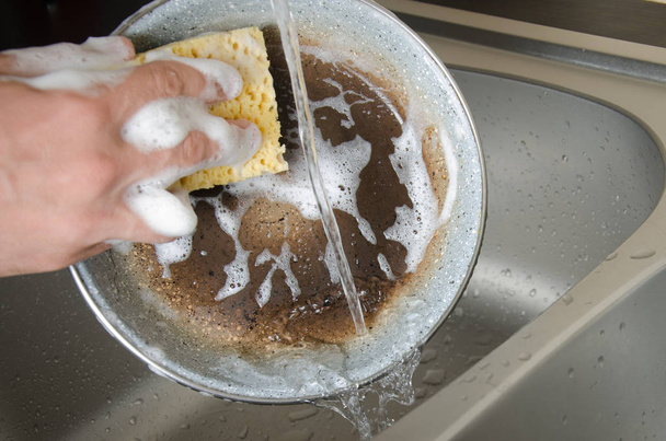 The dishwasher washes the dishes with a detergent - Valokuva, kuva