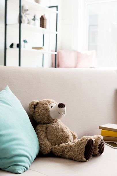 close-up shot of cute teddy bear on couch at home - Zdjęcie, obraz