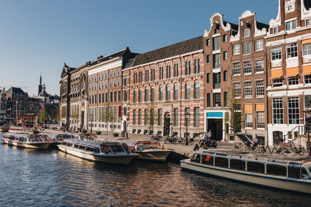 20 MAY 2018 - AMSTERDAM, NETHERLANDS: beautiful ships on canal at Amsterdam, Netherlands - Zdjęcie, obraz