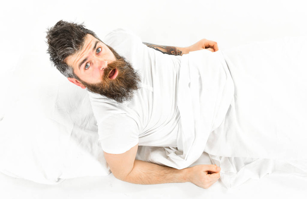 Hipster with beard and mustache waking up. - 写真・画像