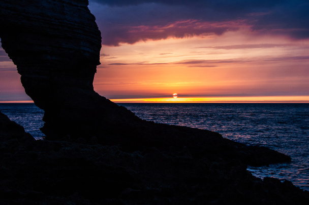 tranquil shot of rocky cliff on cloudy sunset, Etretat, France - Photo, Image