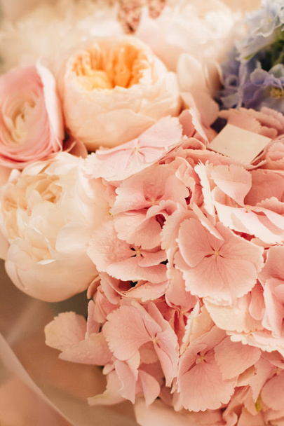 beautiful spring bouquet with tender pink ranunculus and hydrangea flowers, elegant floral decoration  - Φωτογραφία, εικόνα