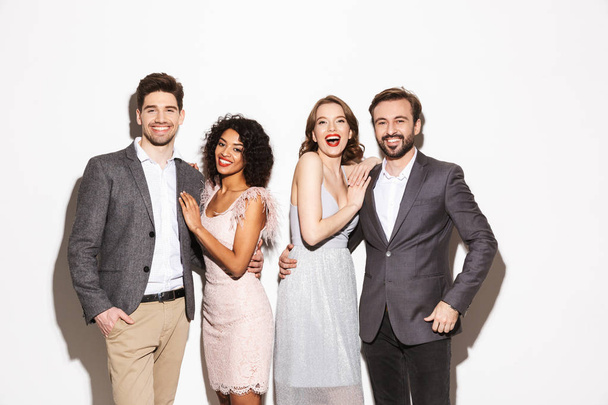 Group of well dressed multiracial people standing together isolated over white background - Foto, Bild