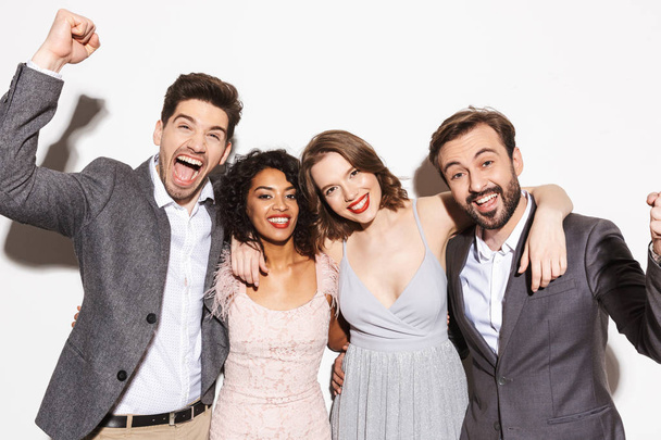 Group of happy well dressed multiracial people celebrating together isolated over white background - Foto, afbeelding