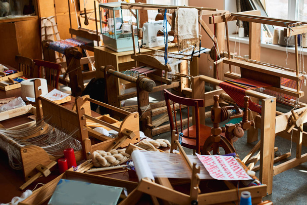 interior of textile manufacturing workshop with wooden looms - Fotografie, Obrázek