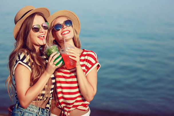 two European girls have fun in the summer on the beach - Zdjęcie, obraz