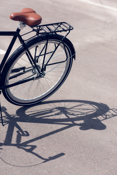 close up view of retro bicycle parked on street - Photo, image