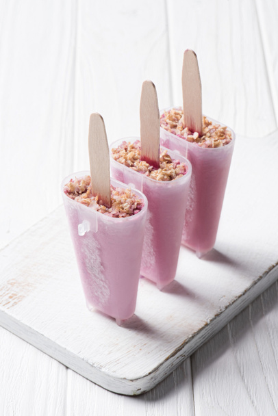 Berry ice pops in molds on wooden background - Photo, Image