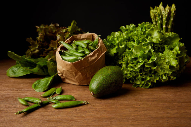 close-up shot of fresh green vegetables on wooden surface - Photo, Image