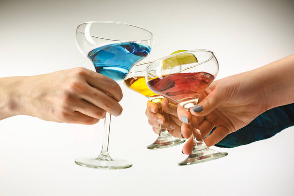 The male and female hands with exotic cocktails - 写真・画像